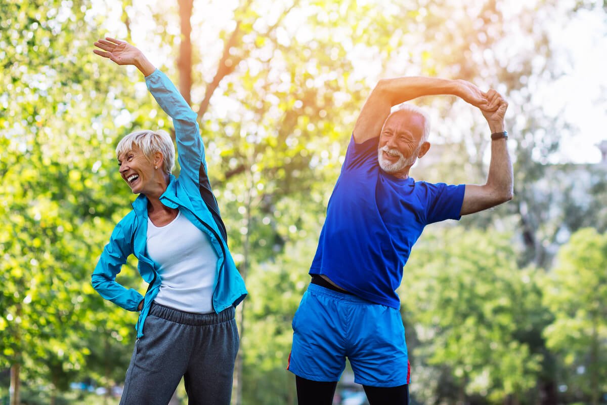 Happy Senior Woman and a Man Stretching