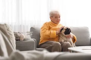 Happy older woman with her dog