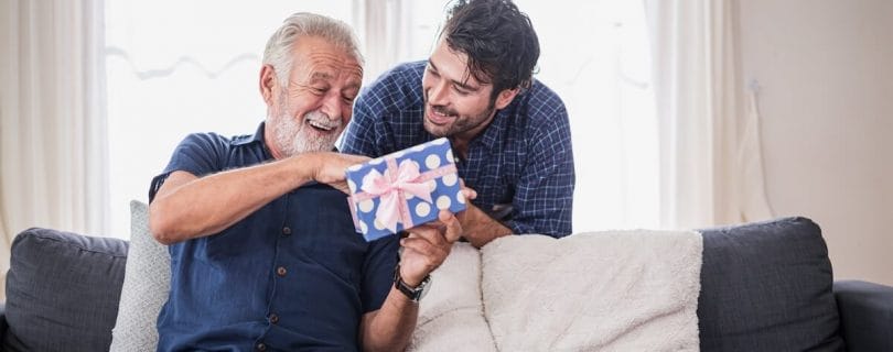 Adult son surprising his father with a gift