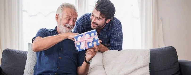 Adult son surprising his father with a gift