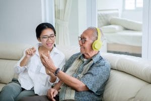 Older adult getting support from a caregiver