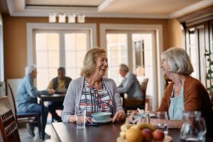 Older adults having a meal together