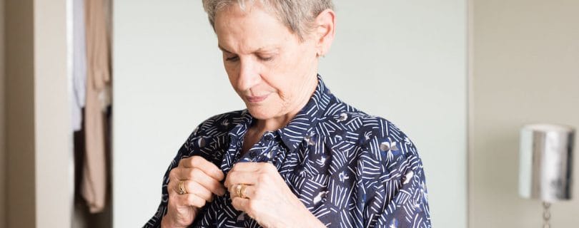 Older woman getting dressed up