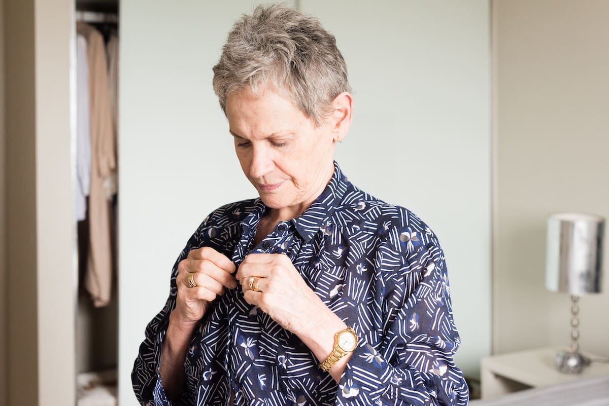 Older woman getting dressed up