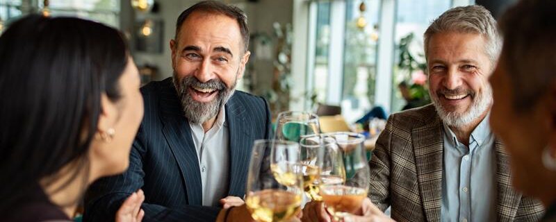 adult senior cheering wine